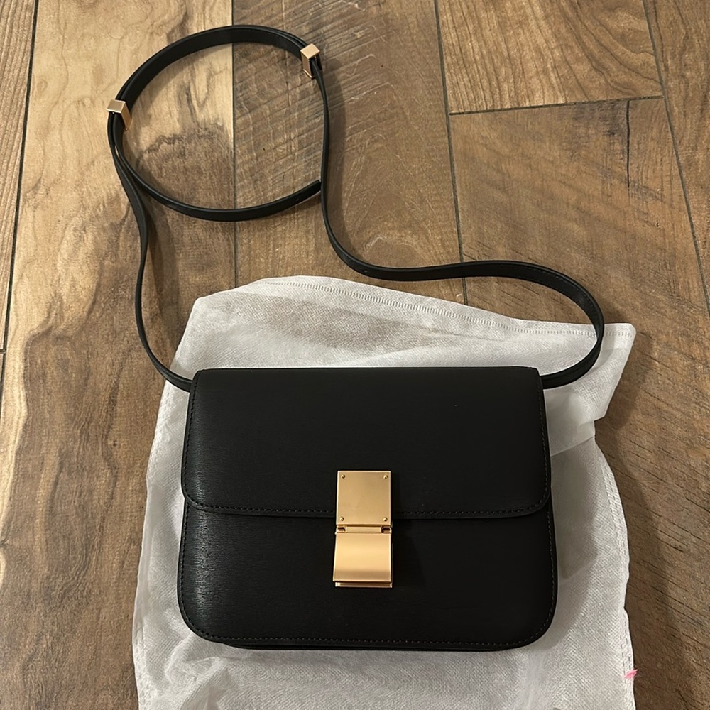 Elegant Black Crossbody Bag with Gold Accents